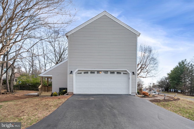 view of side of property featuring driveway