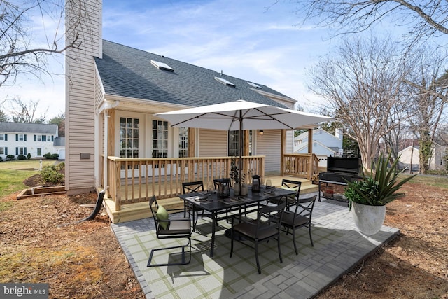 view of patio / terrace featuring a wooden deck and outdoor dining space