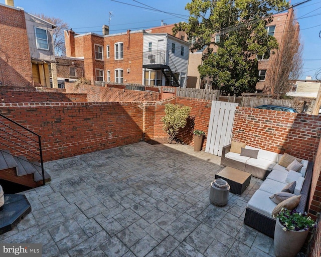 view of patio featuring fence