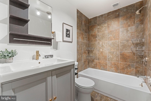 full bathroom with vanity, toilet, washtub / shower combination, and visible vents