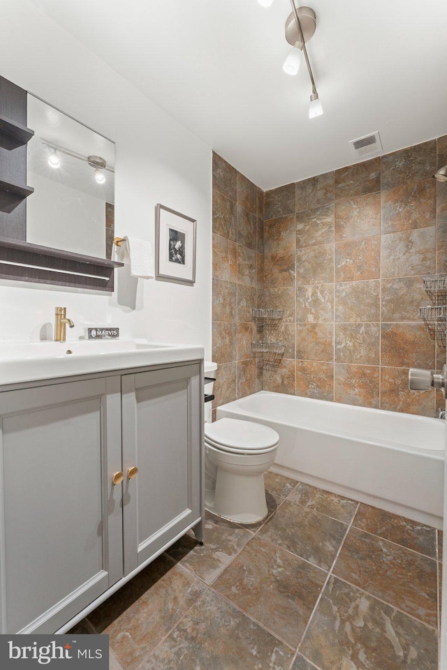 bathroom featuring vanity, shower / tub combination, toilet, and visible vents