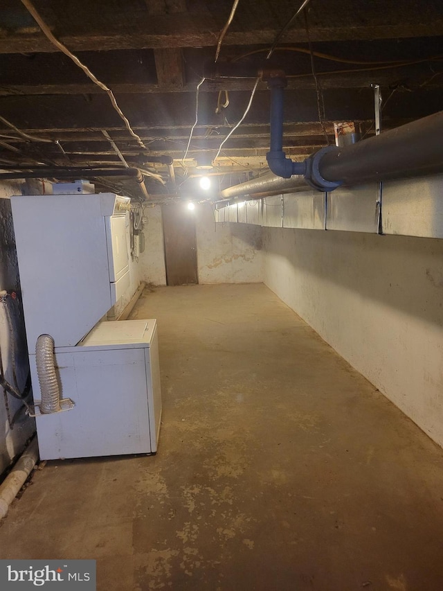 unfinished below grade area featuring refrigerator