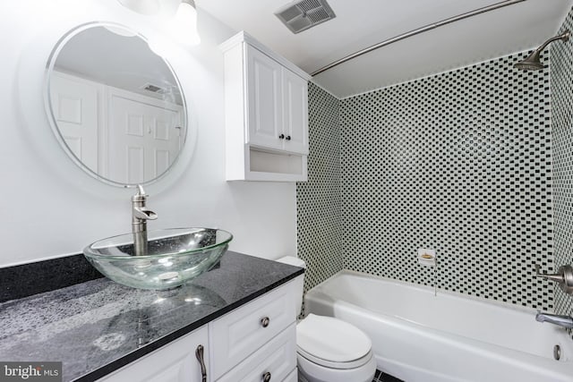 full bathroom featuring visible vents, toilet, shower / bath combination, and vanity