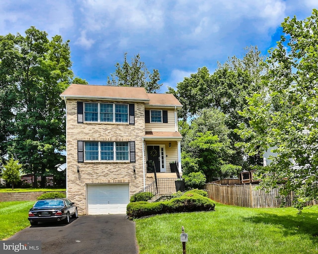 view of front of house featuring fence, a front lawn, a garage, aphalt driveway, and brick siding