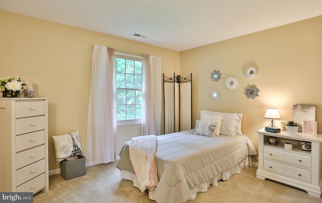 carpeted bedroom with visible vents