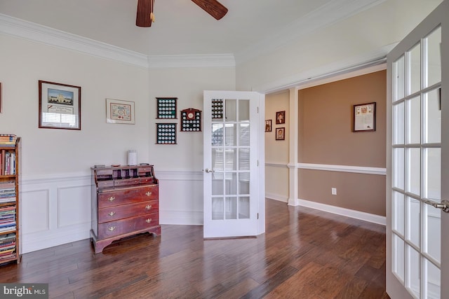 spare room with wainscoting, french doors, dark wood-style flooring, and ornamental molding