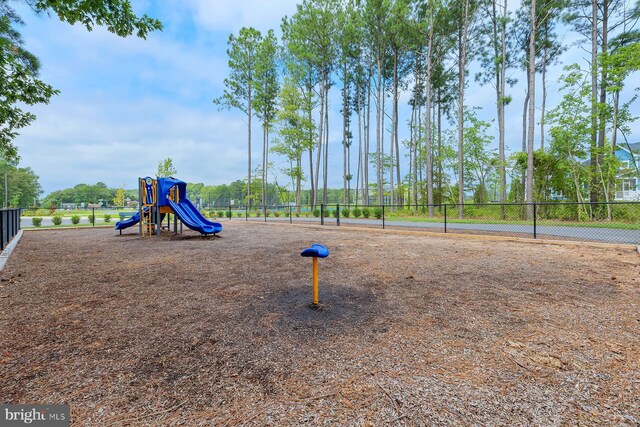 communal playground featuring fence