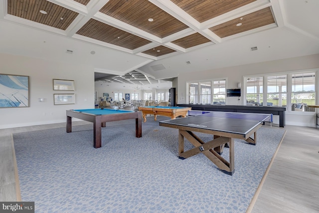 game room featuring light wood finished floors, wood ceiling, a towering ceiling, coffered ceiling, and billiards