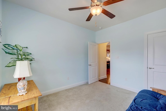 bedroom featuring a ceiling fan, baseboards, arched walkways, and carpet floors