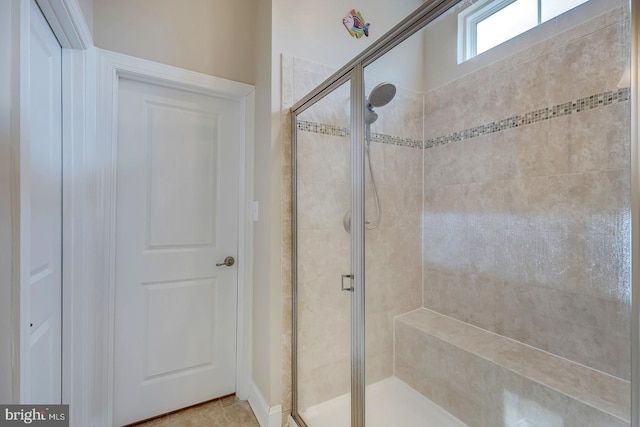 full bathroom featuring a shower stall