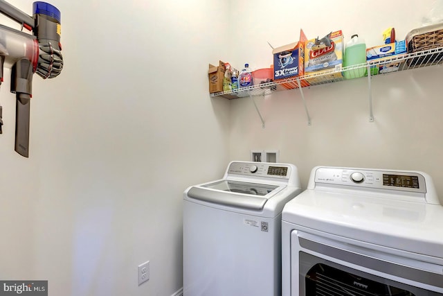 laundry room with washer and clothes dryer and laundry area