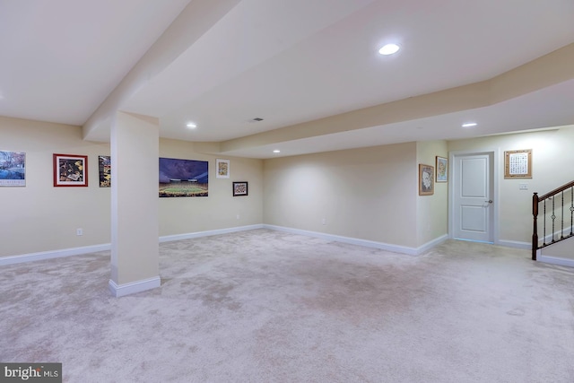 finished basement with recessed lighting, stairs, and baseboards