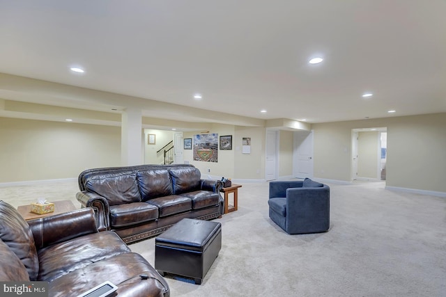 living room featuring stairway, recessed lighting, baseboards, and light carpet