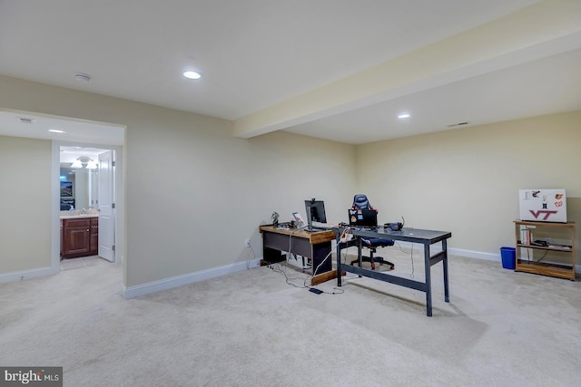 home office with beam ceiling, recessed lighting, baseboards, and light carpet