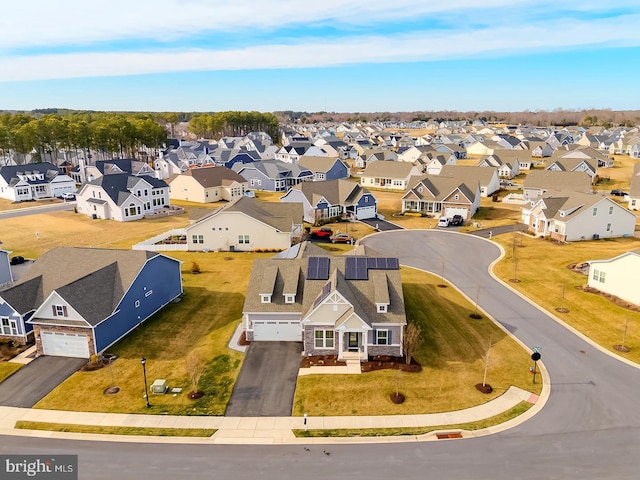 birds eye view of property with a residential view