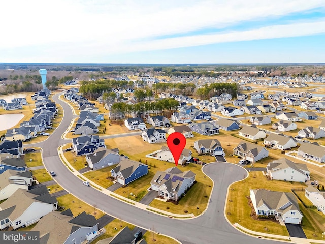 birds eye view of property with a residential view