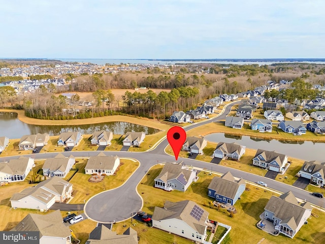 aerial view featuring a residential view and a water view