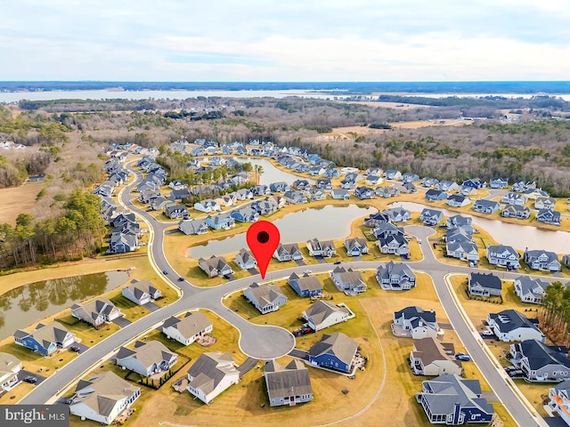 birds eye view of property featuring a residential view and a water view