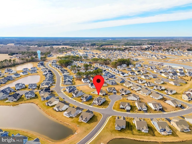 bird's eye view featuring a residential view and a water view