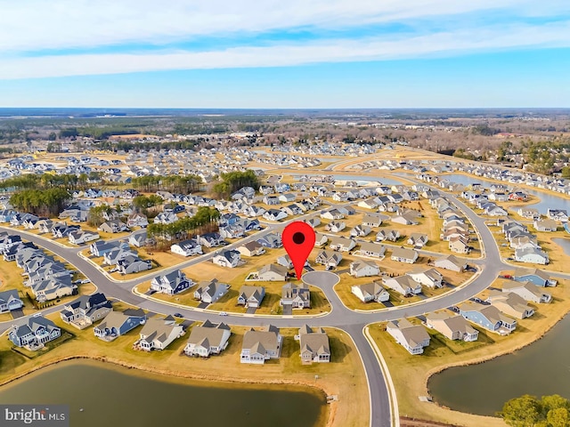 bird's eye view featuring a residential view and a water view