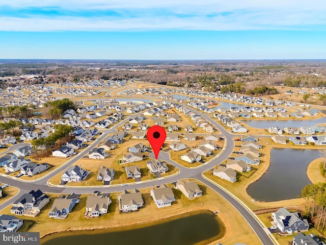 bird's eye view featuring a residential view and a water view