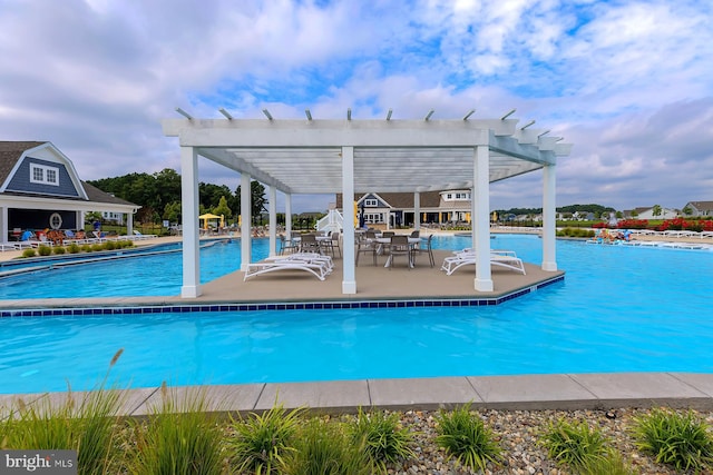 community pool featuring a patio area and a pergola