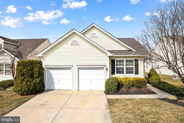 view of front of property with a garage and driveway