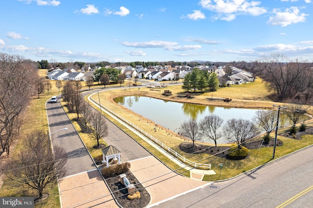 bird's eye view with a residential view and a water view