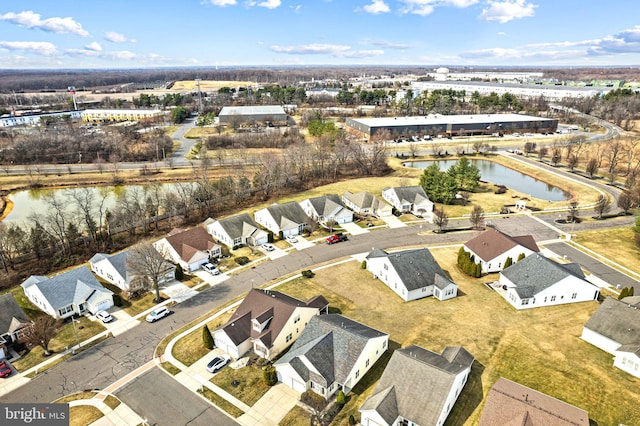 aerial view with a residential view and a water view