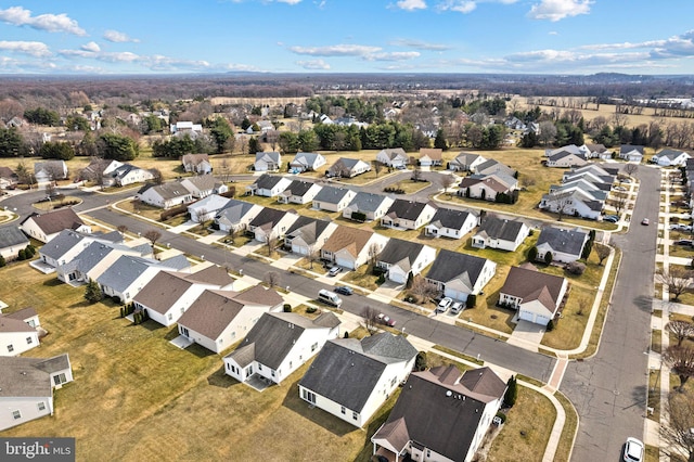 birds eye view of property with a residential view