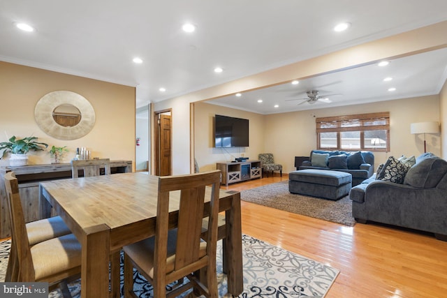 dining space with ceiling fan, recessed lighting, light wood-type flooring, and ornamental molding