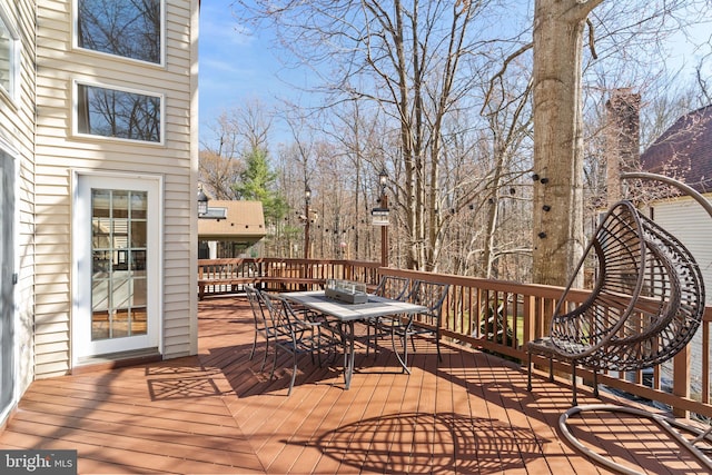 wooden deck with outdoor dining area