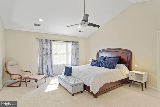 carpeted bedroom with visible vents, a ceiling fan, and vaulted ceiling