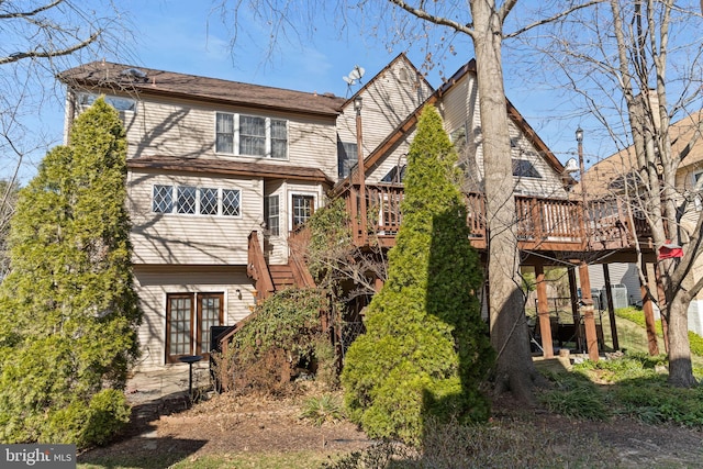 exterior space featuring stairway and a deck