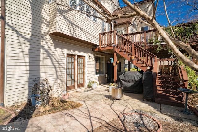 view of patio / terrace featuring stairs and a grill