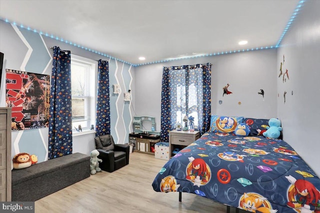 bedroom featuring wood finished floors