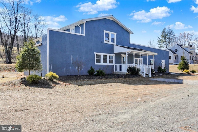 view of front of property with stucco siding and a porch