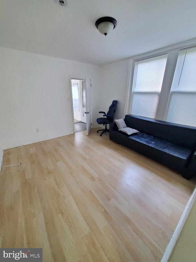 unfurnished room with wood finished floors