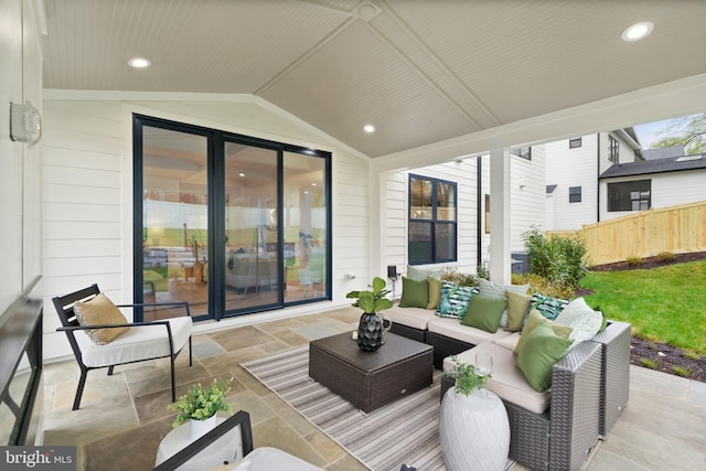 view of patio with an outdoor hangout area and fence