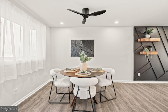 dining room featuring recessed lighting, baseboards, wood finished floors, and a ceiling fan