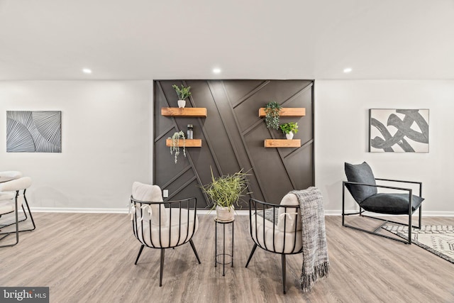 sitting room with recessed lighting, wood finished floors, and baseboards