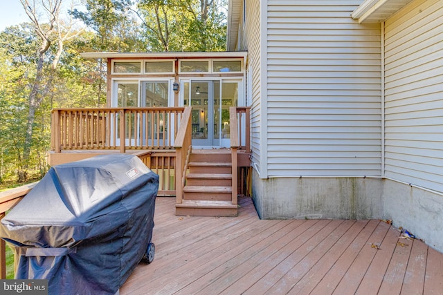 wooden terrace featuring a sunroom