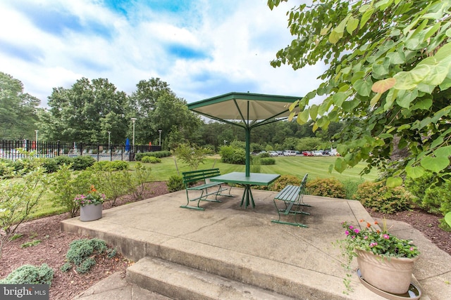 view of patio / terrace with outdoor dining space and fence