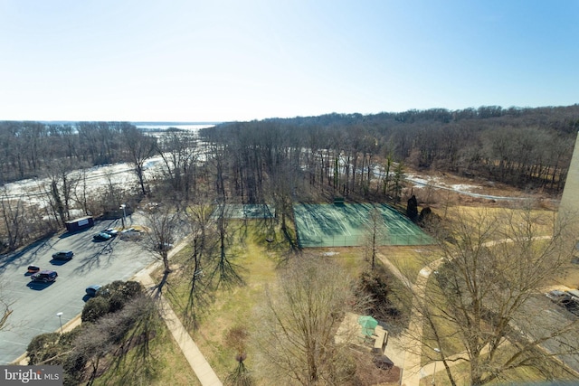 bird's eye view featuring a wooded view