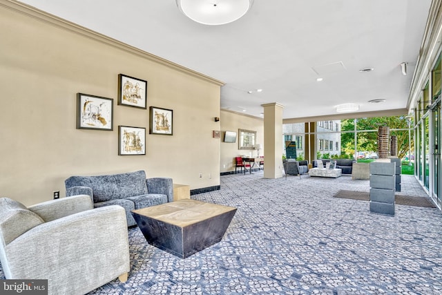 interior space with baseboards, decorative columns, carpet, and ornamental molding