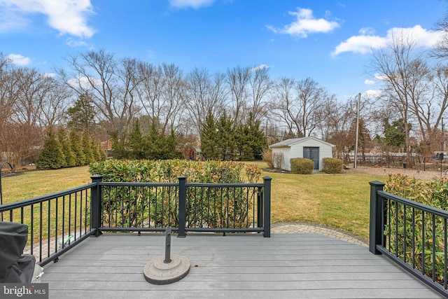 deck featuring a lawn and an outdoor structure