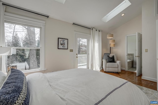 bedroom with wood finished floors, baseboards, vaulted ceiling with skylight, recessed lighting, and access to exterior