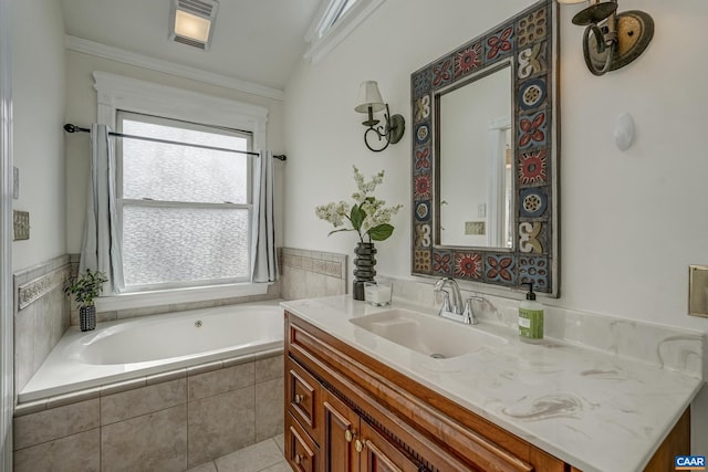 full bathroom with tile patterned floors, visible vents, ornamental molding, a bath, and vanity