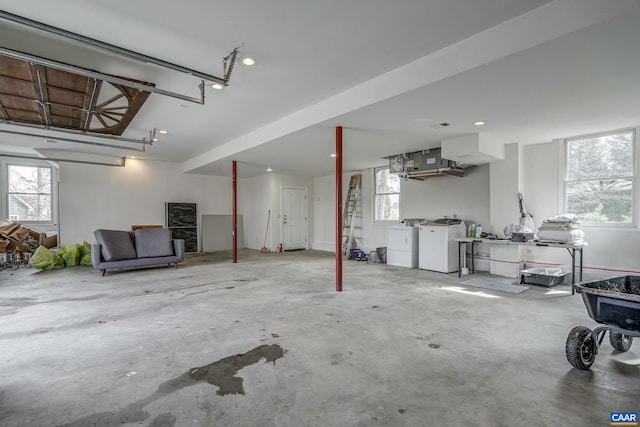 garage featuring washing machine and dryer