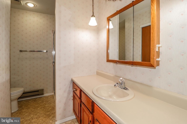 bathroom with a shower stall, wallpapered walls, a baseboard heating unit, toilet, and vanity